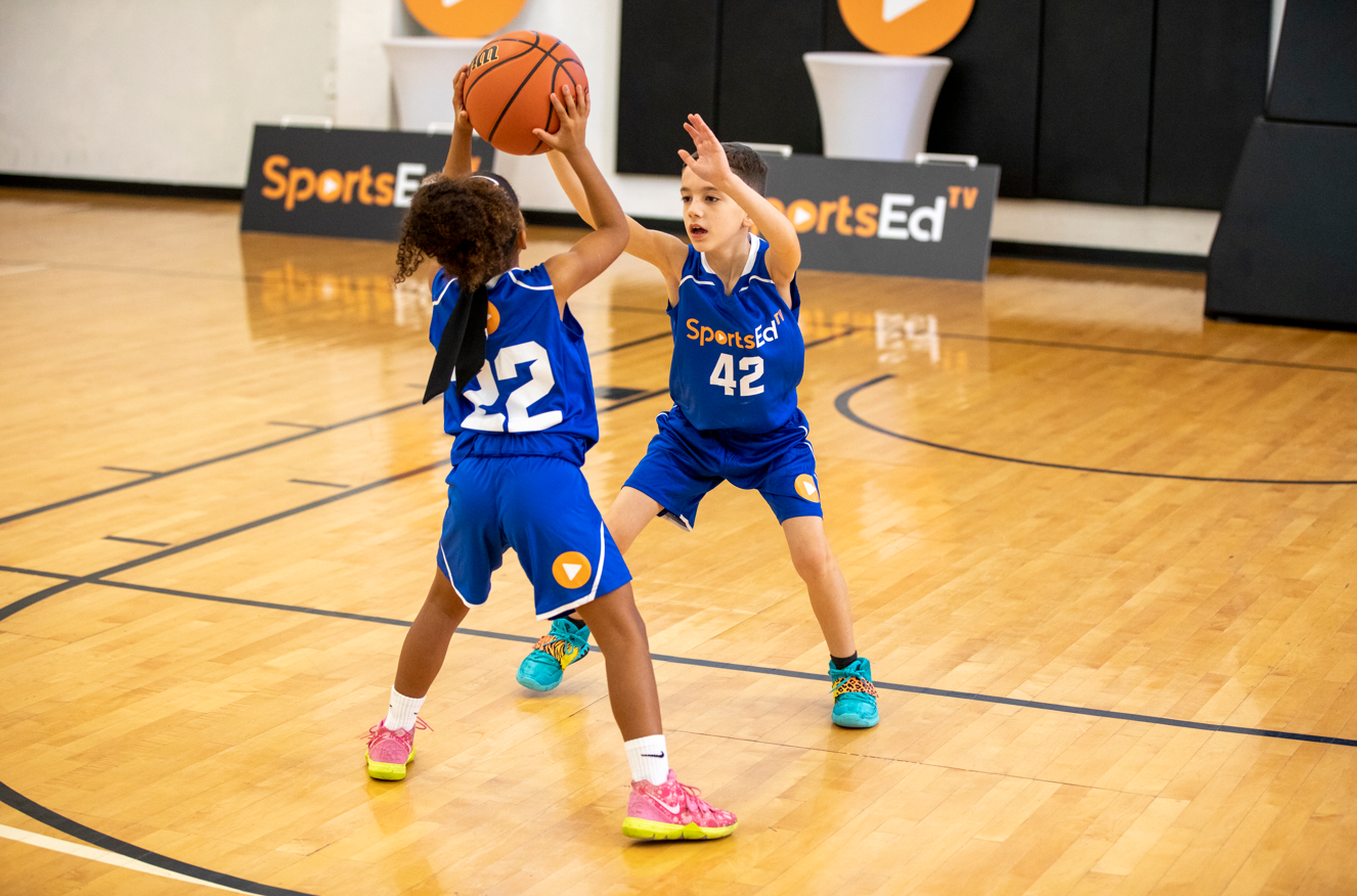 2 kids playing basketball 2 kids playing basketball