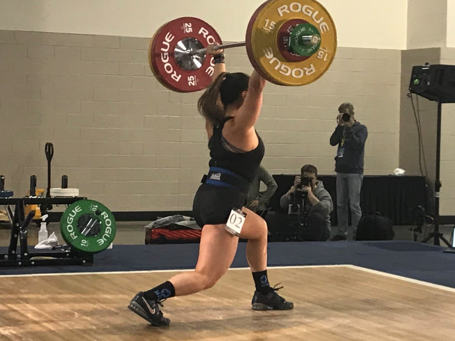 woman lifting weights in a gym